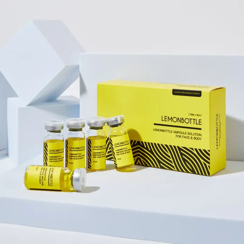 Yellowampoules and packaging with 'Lemonbottle' branding on a white background. Lemonbottle fat dissolver for targeted fat reduction. 